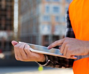 close-up-construction-engineer-using-tablet